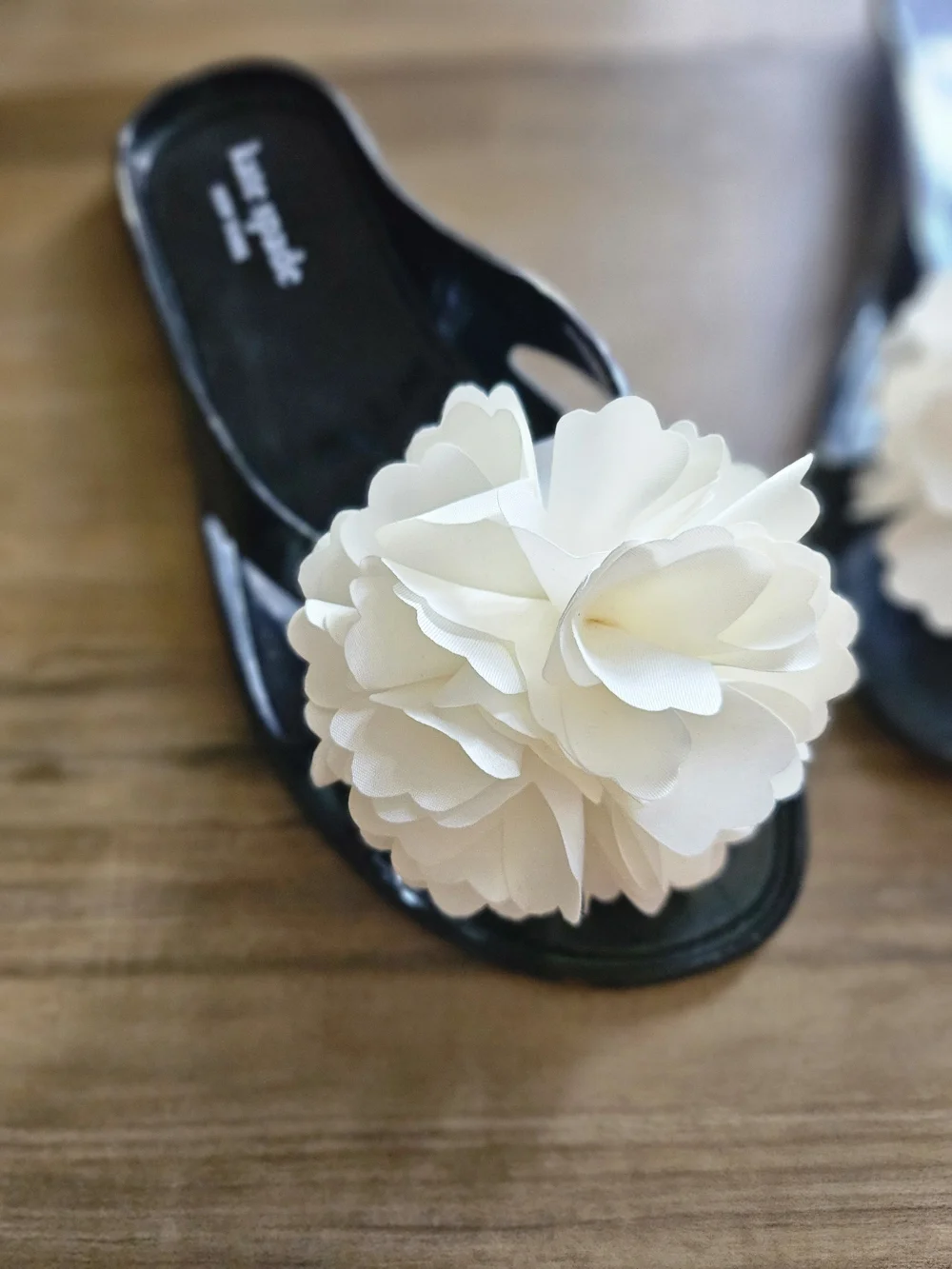 Kate Spade Black Jelly Slide Sandals with White Floral Accent